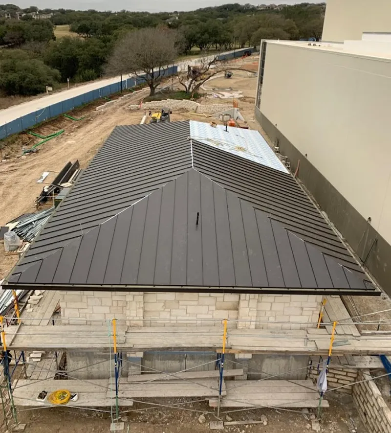 Metal roof new construction with scaffolding in Riverside